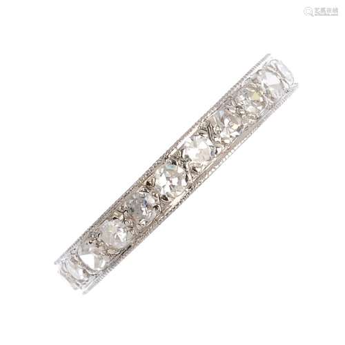 A diamond eternity ring. The single-cut diamond line, within a mille grain border. Estimated total