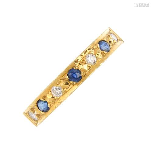 An 18ct gold sapphire and diamond seven-stone ring. Designed as an alternating circular-shape