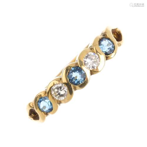 An 18ct gold synthetic spinel and diamond half eternity ring. Designed as an alternating circular-