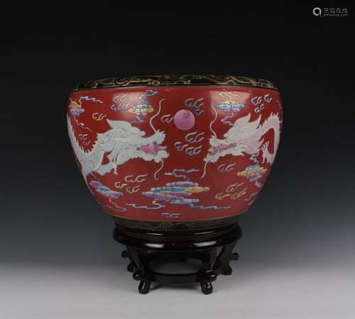 CHINESE PORCELAIN RED GROUND FAMILLE ROSE DRAGON FISH BOWL