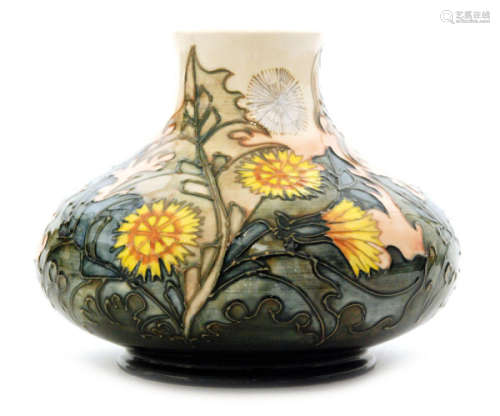 A Moorcroft Pottery vase of compressed form decorated in the Dandelion pattern, designed by Sally Tuffin, impressed marks, numbered to the base 50 of 200, height 17cm