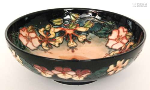 A Moorcroft Pottery footed bowl decorated in the Oberon pattern, designed by Rachel Bishop, impressed and painted marks, diameter 26cm