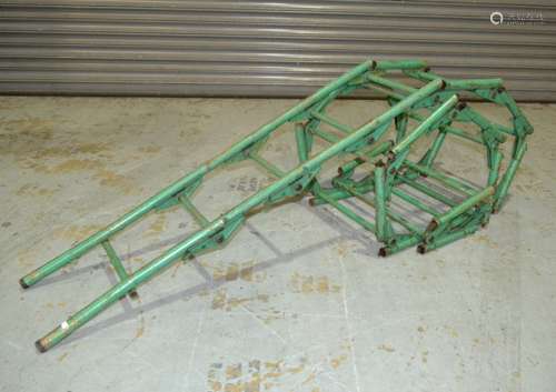 A 20th Century American fabulous folding ladder, painted tubular steel locking sections with extensions.