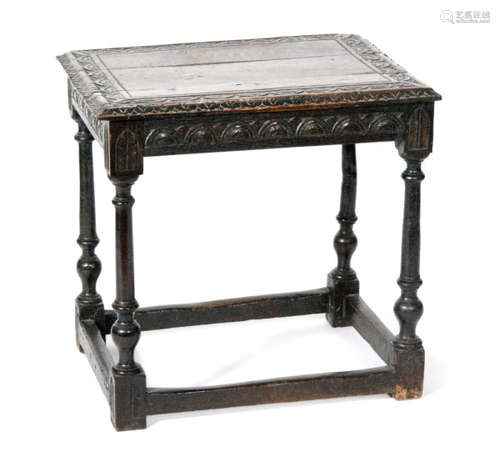 An 18th Century and later carved oak side table, with a lunette carved border frieze above turned legs and a stretcher frame, S/D, height 63cm and width 64cm.