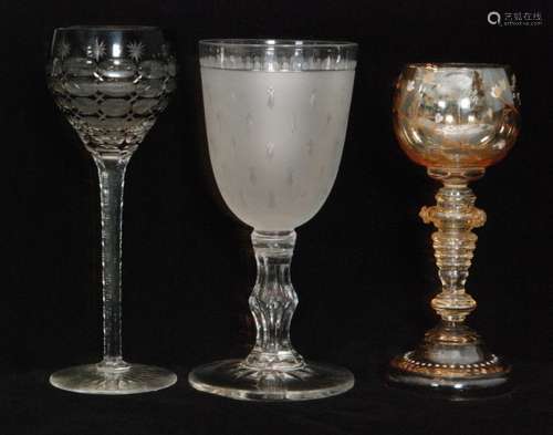 A 19th Century Richardsons wine glass, the funnel bowl cut with repeat mitre and printie motives over the satin ground raised on a hollow blown faceted stem and spread foot, together with a Moser roemer glass in pale brown with enamelled floral decoration to the owl, and a Czech hock glass cased and cut with repeat printie cuts, tallest 20cm. (3)