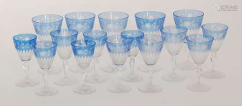 A later 20th Century Royal Brierley part suite of glasses comprising five red wine, six white wine and five sherry glasses with conical bowls the upper section cased in pale blue and engraved with a band of roses above repeat column cutting to the base all raised on a faceted stem and spread foot, acid marked, tallest 15.5cm. (16)