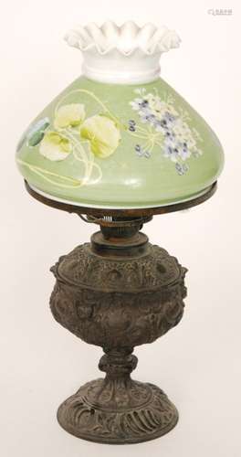 A Victorian cast metal oil lamp in the renaissance style and a similar lamp with green shade and violet decoration (2)