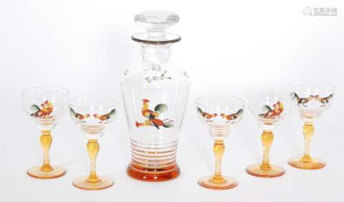 A 1930s Stuart & Sons cocktail decanter of shouldered form above an amber foot enamel decorated with a cockerel, height 23cm, together with five cocktail glasses in the conforming pattern, acid marked, height 11.5cm. (6)