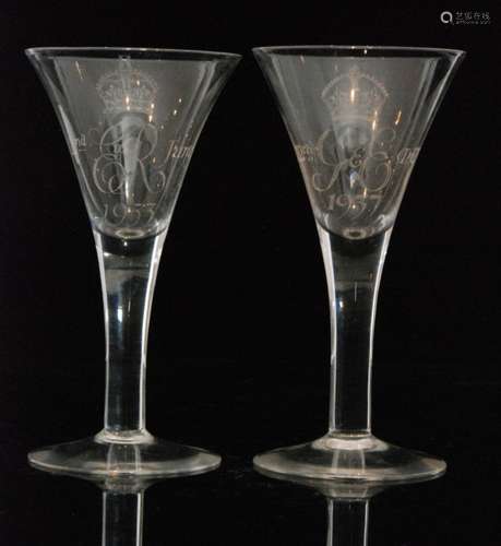 A post war Whitefriars clear crystal commemorative Queen Elizabeth II coronation glass in the 18th Century taste with a trumpet form bowl and plain stem, together with a another example for George V, engraved signatures, height 20cm. (2)