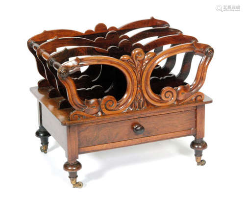 A Victorian rosewood three-division Canterbury, with acanthus scroll detail above a single frieze drawer and turned legs, height 46cm and width 53cm, S/D.