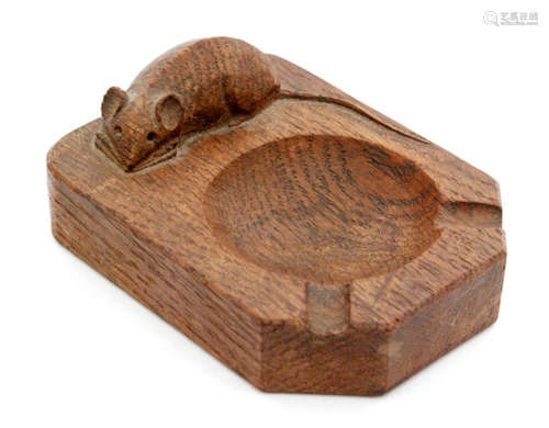 A Robert 'Mouseman' Thompson oak ashtray of rectangular form with canted corners and with carved 'mouse' signature, width 10cm.