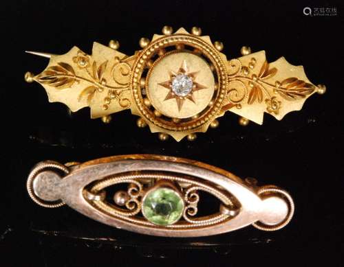 An early 20th Century 9ct rose gold oval bar brooch set with a single centre peridot, Murrle Bennett & Co, with a similar 15ct diamond set example. (2)