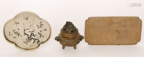 A small Chinese bronze koro with dog of Fo cover resting on a pearl, height 11.5cm, also two small brass trays one engraved with figures, width 22cm (3)