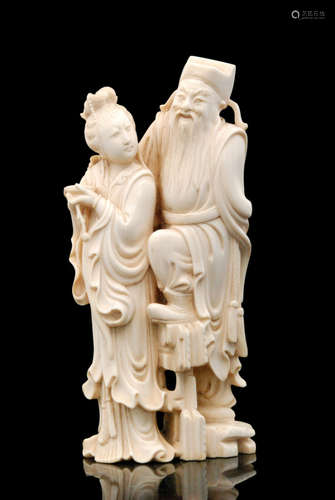 An early 20th Century Japanese ivory okimono of a bearded elder standing behind a girl in flowing gown holding a bowl in her hands, height 18cm, S/D