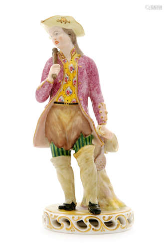 An early 20th Century Derby figure of a Tinker, he stood in a pink overcoat with a yellow patterned shirt, striped trousers and long gaters with pots and pans in his hand and over his shoulder, puce painted crown, crossed batons D mark and initialled WH for William Hargreave, height 22cm