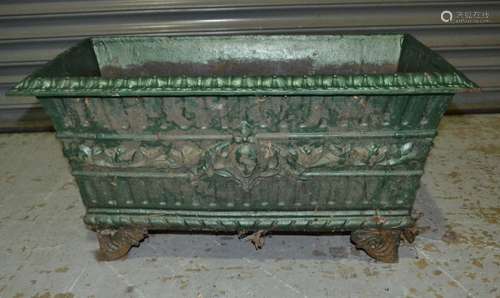 A Victorian style and later green painted cast iron rectangular trough decorated with acanthus and dentil border on bracket feet, length 72cm