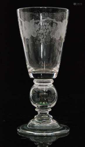 A 1940s Stevens & Williams crystal glass Newport Tower commemorative goblet by William Swingewood, the folded domed foot rising to a hollow ball knop with Newport Tower lampwork inside all below the flared bowl engraved with bruiting vines to the rim, unmarked, height 23cm.