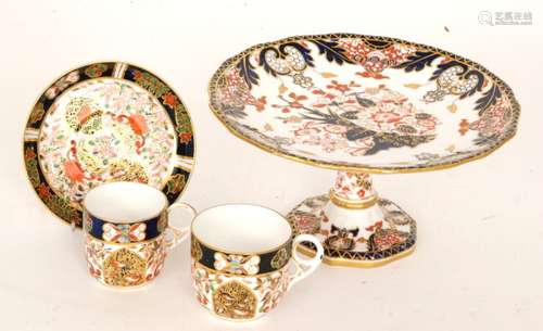 A late 19th Century Royal Crown Derby comport decorated in the Imari 383 pattern, printed mark, height 12.5cm, diameter 24cm, together with a Derby coffee cup, breakfast cup and saucer all decorated in an Imari pattern (3)