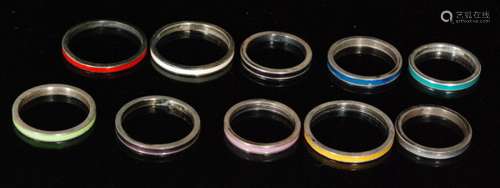 Ten assorted silver rings each with a different colour enamel decoration, various sizes, all Bernard Instone. (10).