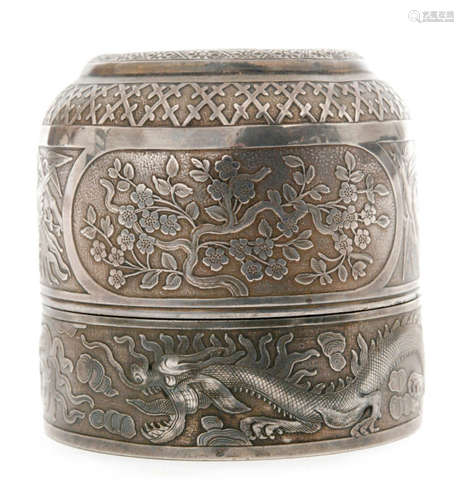 A Chinese silver opium lamp, the cover decorated with a stylised dragon over panels of fauna and exotic birds to the sides, height 7.5cm