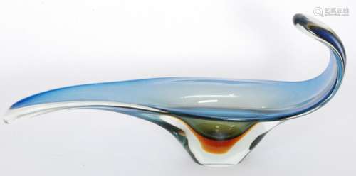 A large post war Italian Murano glass table centre bowl in the manner of Seguso, of elongated elliptical form with a pulled and folded rim internally Sommerso cased in amber over blue and all cased in clear crystal, unmarked, length 60cm.