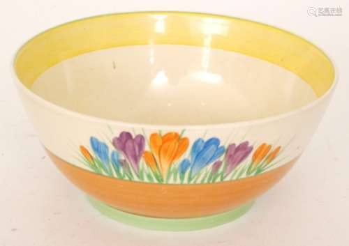 A Clarice Cliff Royal Staffordshire A.J Wilkinsons Honeyglaze footed bowl decorated in the hand painted Crocus pattern, printed mark with gilt script signature, diameter 22cm