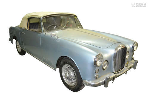 An Alvis TD21 Series II Drophead Coupe motor car, 2993cc, first registered 18th July 1967 but year of manufacture believed to be 1963, one owner from new, metallic blue paintwork and with wire wheels, chassis number 26905, 73536 recorded miles, not running and 'sold as seen', currently SORN. The vehicle has been stored in a garage, but with it being 'sold as seen', viewing is essential.  The TD21 was produced from 1958 until 1963; offered with either a four speed manual or three speed automatic transmission and an upgraded 2993cc engine, these prestige sporting motor cars were the pinnacle of mid-twentieth century British engineering. The Series II arrived in 1962 with four wheel disc brakes and by October of that year, a five speed manual ZF gearbox. The TD was replaced in 1963 by the TE21.  The Park Ward TD21 Series II, with styling by Graber of Switzerland, is arguably the most desirable model of the Alvis TD/TE/TF range, with its integral spot and fog lamps and elegant, sophisticated styling. Two hundred and eighty-nine TD21 Series II models were produced, and of that number just fifty-three were Drophead Coupes.