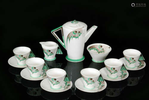 A 1930s Art Deco Shelley Mode shape coffee set designed by Eric Slater and decorated in the Green Butterfly Wing pattern, comprising coffee pot, milk jug, sugar bowl and six cups and saucers, each with green printed marks and painted pattern code 11762 (15)