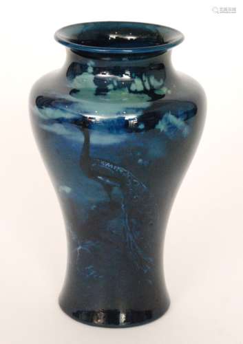 A Royal Worcester Sabrina Porcelain shape 2195 vase of high shouldered form decorated with a peacock perched on a rock beneath a moonlit sky, probably by Walter Sedgley, printed mark with date code for 1926, height 20.5cm