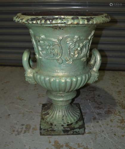 A set of four 19th Century campana shaped cast iron terrace urns bordered with flowers and leaves on square bases , height 63cm (4)