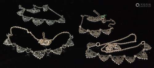 A hallmarked silver and marcasite set necklet with seven scroll stone set panels, with three similar silver examples, all Bernard Instone. (4)