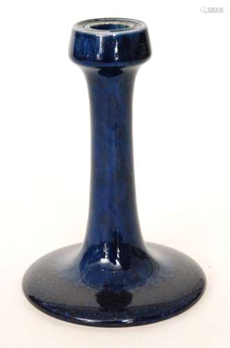 An early 20th Century Ruskin Pottery souffle glaze candlestick, the whole glazed in blue, impressed mark and dated 1910, height 18cm, S/D