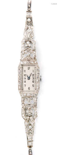 An Art Deco platinum and diamond cocktail watch, the rectangular silvered dial with Arabic numerals to a diamond set bezel, pierced millegrain set diamond bracelet terminating with tongue and box clasp, movement stamped Gelda.