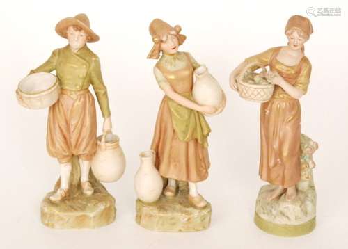 Three assorted Royal Dux Bohemia figures each in shot enamels with gilt detailing, comprising models 1839, 983 and 984, each with applied pink triangle marks, tallest 28cm