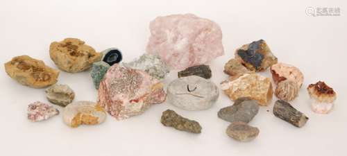 A collection of minerals, fossils and quartites contained in a mahogany framed table top display cabinet on cabriole legs, width 80cm