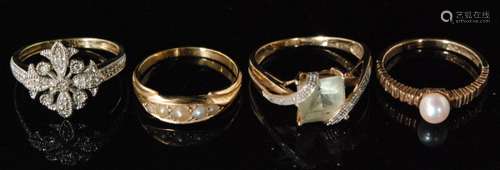 A hallmarked 9ct pearl set ring with ridged shoulders and plain band, an 18ct pearl set boat head ring, a diamond flower head cluster ring and another stone set example (4)