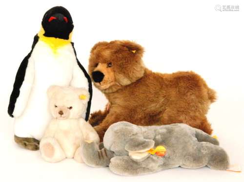 A 20th Century Steiff grey cosy elephant, another of a brown bear, a small white bear and a penguin (4)