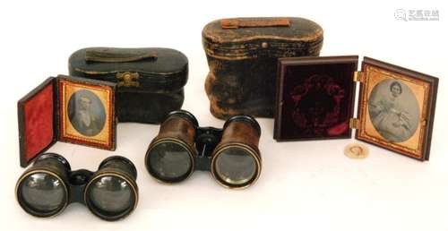 A Victorian ambrotype photograph of a lady in a gilt mount and case, a similar example in leather case and two pairs of field glasses (4)