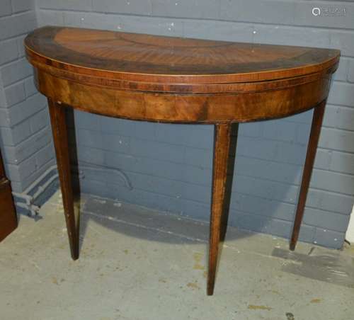 A George IV mahogany crossbanded fold-over demi lune card table, raised to square tapered legs, S/D, width 99cm.