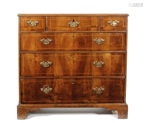 A Georgian mahogany chest of six drawers, with walnut veneered top and cross banded borders, all above bracket feet, some later repairs, width 95cm.