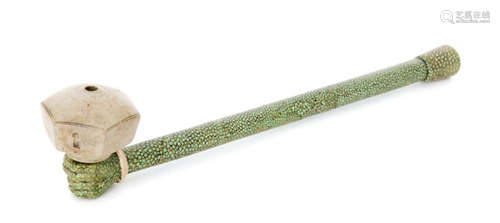 A Chinese shagreen opium pipe in the form of a fist with conforming mouth piece and greyware octagonal bowl, length 31cm