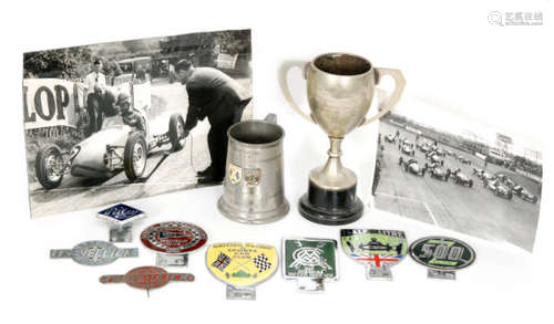 Motor racing interest - A collection of mid 20th Century black and white racing and hill climb photographs to include Shelsey Walsh, drivers passes, loose and framed photographs together with various enamelled car badges 'British Racing Sports Car Club', 'Half Litre Car Club' also two trophy cups and a tankard awarded to P Trevellick for 500cc non production car competitions circa 1953. (qty)