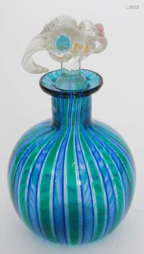 A post war Italian Murano glass scent bottle by Linea Valentina of globe and shaft form with green and blue Canne decoration all below a clear crystal leaf form stopper with aventurine highlights and applied pastel coloured flower heads, unmarked, height 13.5cm.