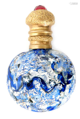 A 19th Century Italian glass scent bottle in the manner of Franchini Bigaglia, of compressed ovoid form decorated with murrine star canes and silver aventurine over the marbled blue and opal ground, all below gilt mounts and an internal cork stopper, height 6.5cm.