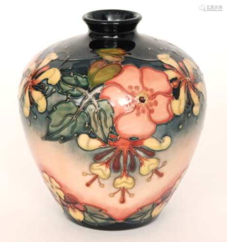 A Moorcroft Pottery vase decorated in the Oberon pattern designed Rachel Bishop, impressed and painted marks, signed in gold Rachel Bishop des, height 18.5cm