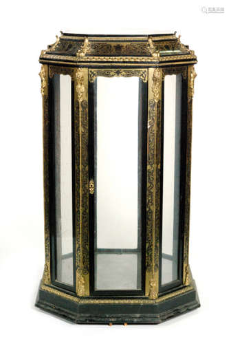 A late 19th Century ebonised and foliate brass inlaid vitrine cabinet of octagonal form, with acanthus scroll ormolu mounts and with a stepped plinth base, height 120cm and width 73cm, S/D.