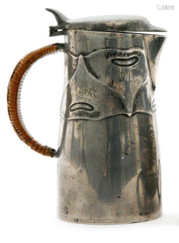 A Liberty & Co pewter hotwater jug, of tapered form and cast in low relief with a stylised band, with wicker bound handle, stamped English Pewter 0278, height 14.5cm, S/D.