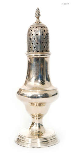 A George III hallmarked silver castor, of baluster form with pierced pull off cover and flame finial, London 1783, SL