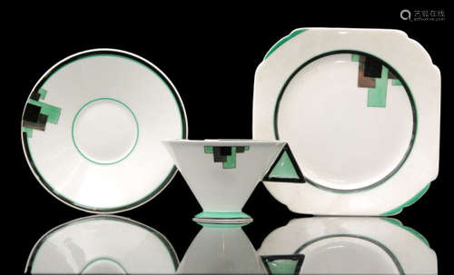 A 1930s Eric Slater for Shelley Art Deco Mode shape trio decorated in the (Green) Blocks pattern with silver lustre detailing, printed marks, pattern 11785 (3)