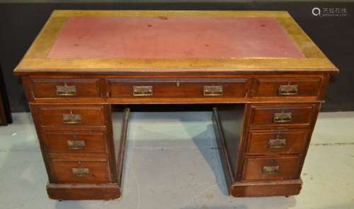 A Victorian mahogany pedestal kneehole desk fitted with nine drawers on a plinth base, width 122cm